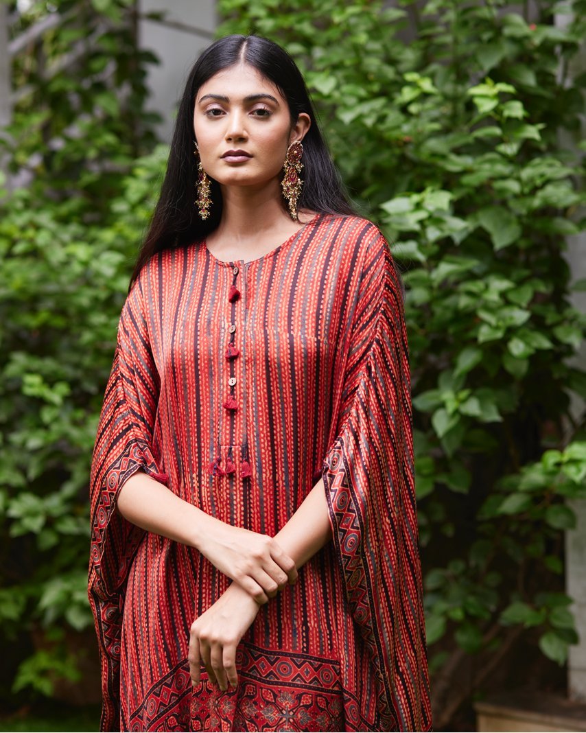 Red Striped Silk Kaftan at Kamakhyaa by Mayura Kumar. This item is Ajrakh Heritage, Casual Wear, Dresses, Festive Wear, Kaftans, Mayura Kumar, Natural, Prints, Red, Relaxed Fit, Stripes, Womenswear