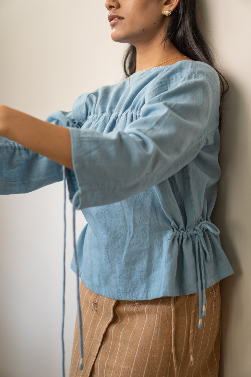 Reversible Ruched Blouse at Kamakhyaa by Lafaani. This item is 100% pure cotton, Blouses, Casual Wear, Light Blue, Materiality, Natural with azo free dyes, Organic, Regular Fit, Reversible, Solids, Womenswear