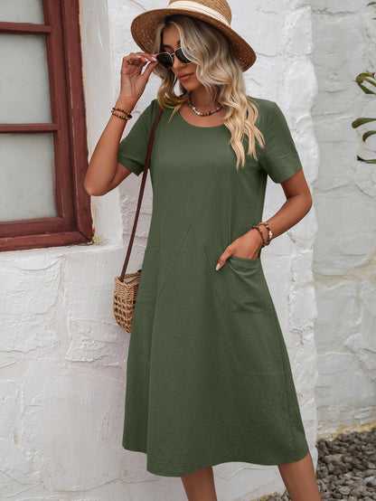 Round Neck Short Sleeve Dress with Pockets at Kamakhyaa by Trendsi. This item is 100% cotton, Beige, Casual Wear, Green, Midi Dresses, Natural, Orange, Relaxed Fit, Solids, Trendsi, Womenswear