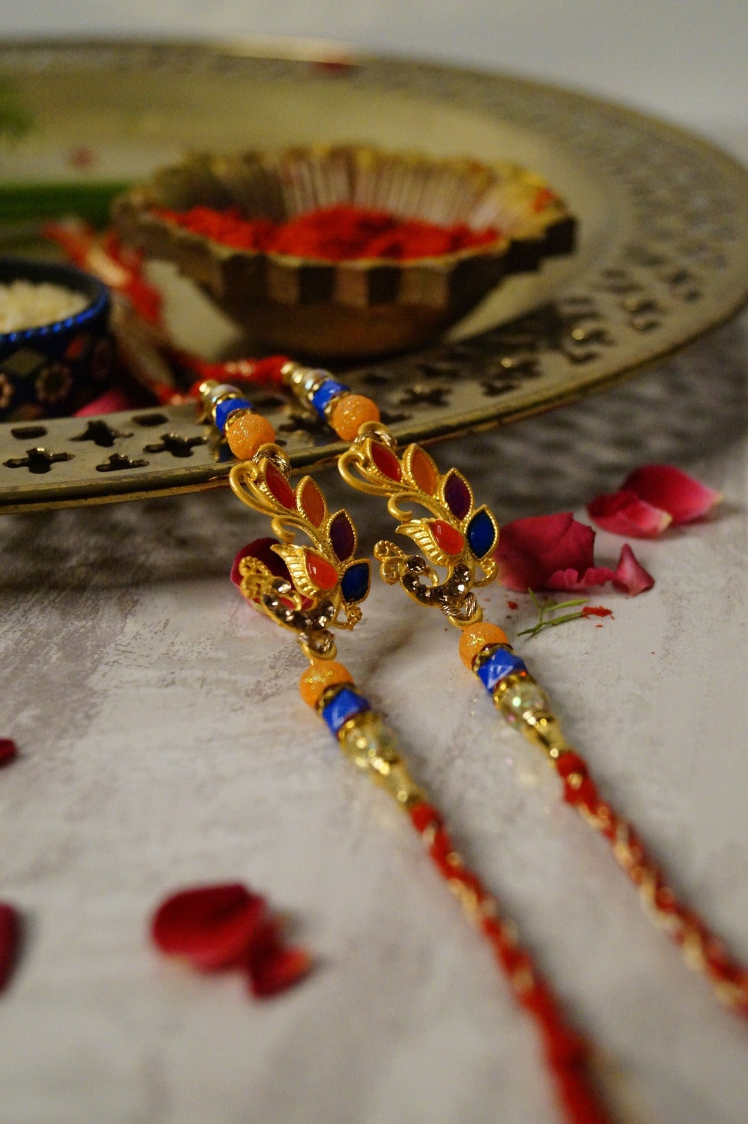 Set Of 2-Peacock Colorful Stone Thread Rakhi at Kamakhyaa by Kamakhyaa. This item is jewelry, Multicolor, Natural, Rakhi, Under 1500, Under 1750, Upcycled