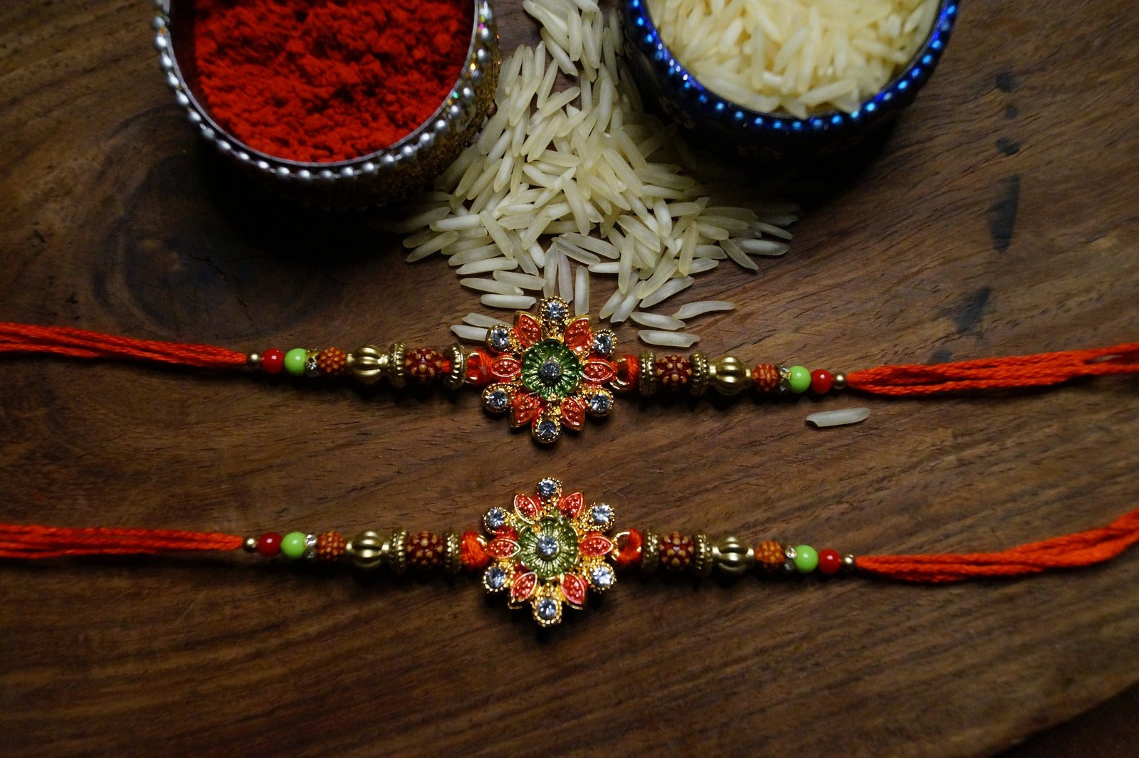 Set of 2-Floral Rudraksh Thread Rakhi at Kamakhyaa by Kamakhyaa. This item is jewelry, Natural, Rakhi, Red, Under 1500, Under 1750, Upcycled