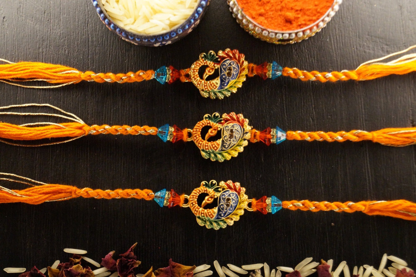 Set of 3-Peacock Gold Brass Thread Rakhi at Kamakhyaa by Kamakhyaa. This item is jewelry, Multicolor, Natural, Rakhi, Under 1500, Under 1750, Upcycled