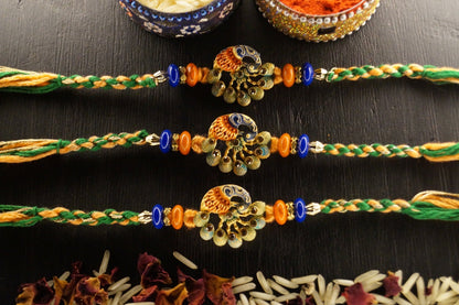 Set of 3-Peacock Stone Thread Rakshi at Kamakhyaa by Kamakhyaa. This item is jewelry, Multicolor, Natural, Rakhi, Under 1500, Under 1750, Upcycled