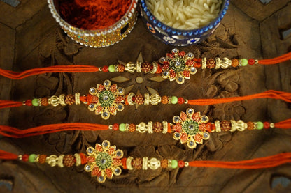 Set of 4-Floral Rudraksh Thread Rakhi at Kamakhyaa by Kamakhyaa. This item is jewelry, Natural, Rakhi, Red, Under 1750, Upcycled