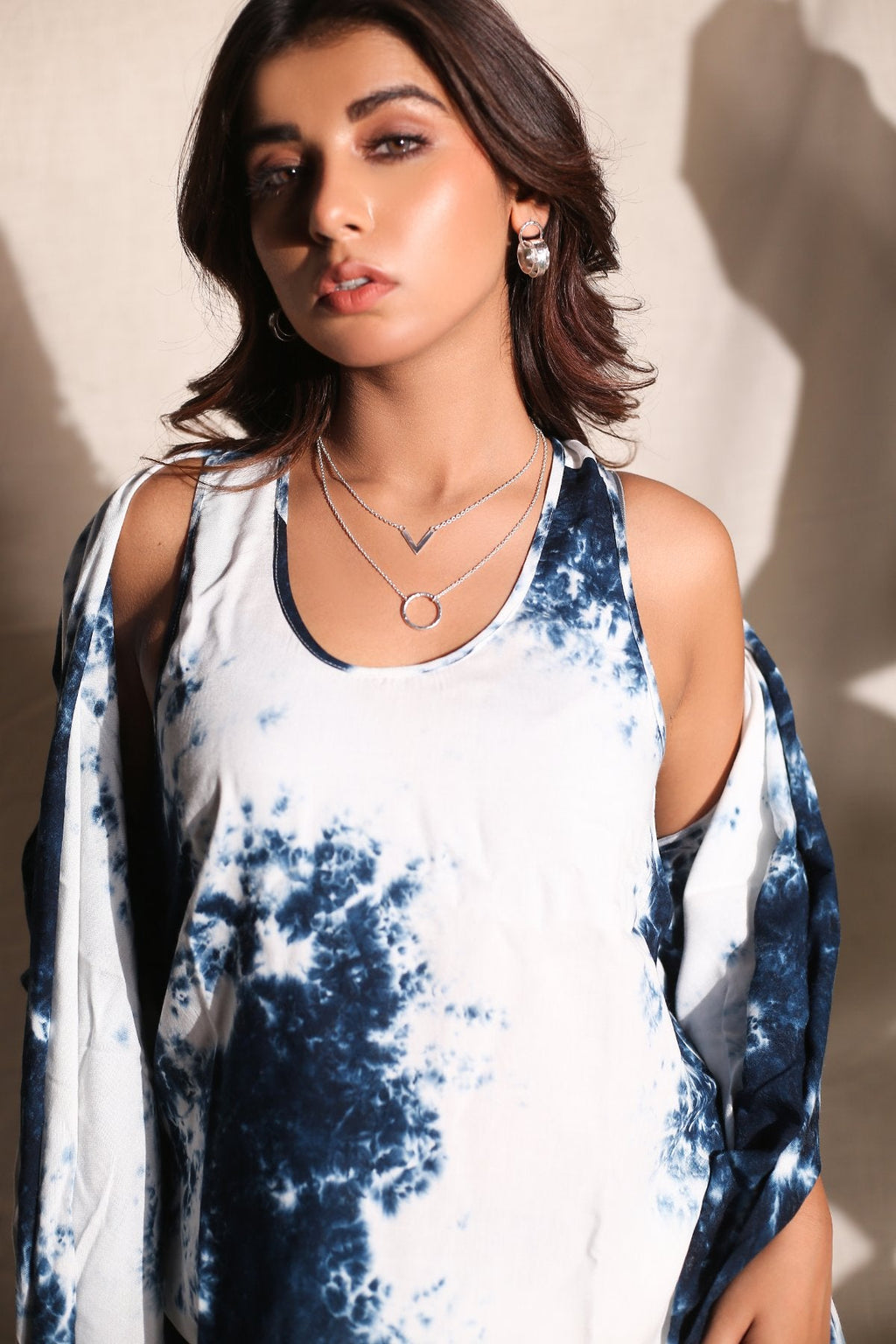 Short, Top And Cape Set of Three at Kamakhyaa by Keva. This item is Black, Co-ord Sets, Day Dream, Lounge Wear Co-ords, Natural, Rayon, Relaxed Fit, Resort Wear, Short Sets, Tie & Dye, Vacation Co-ords, White, Womenswear