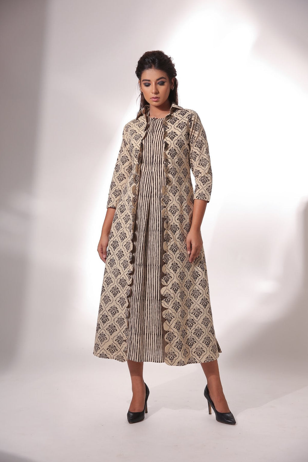 Sleeveless Midi Dress With Cape at Kamakhyaa by Keva. This item is Beige, Best Selling, Black, Block Prints, Cape, Co-ord Sets, Cotton, Dress Sets, Natural, Relaxed Fit, Resort Wear, Womenswear, Zima