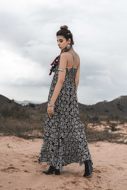 Spaghetti Tiered Long Dress at Kamakhyaa by Keva. This item is Best Selling, Black, Block Prints, Cotton, FB ADS JUNE, Maxi Dresses, Natural, Printed Selfsame, Relaxed Fit, Resort Wear, Sleeveless Dresses, Strap Dresses, Tiered Dresses, Wild Child, Womenswear