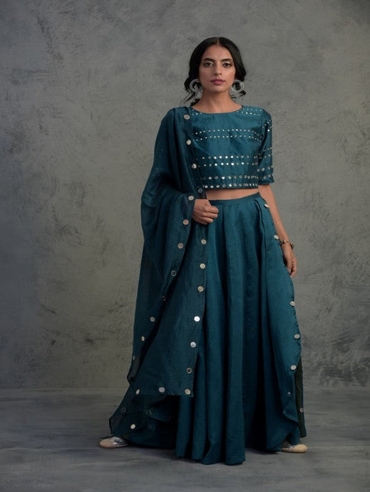 Teal Blue Crop Top Wrap Lehenga Set Of 3 at Kamakhyaa by Charkhee. This item is Blue, Chanderi, Cotton, Embellished, Ethnic Wear, Indian Wear, Lehenga Sets, Mirror Work, Natural, Relaxed Fit, Tyohaar, Wedding Gifts, Womenswear