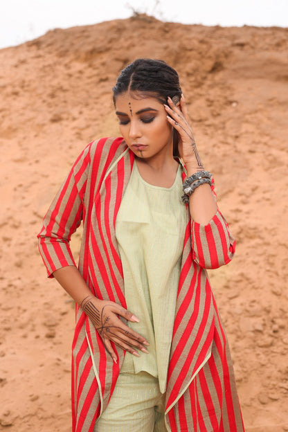Top With Pants And Red Striped Cape - Set Of Three at Kamakhyaa by Keva. This item is Cape, Co-ord Sets, Cotton, Cotton Lurex, Desert Rose, Natural, Office Wear Co-ords, Red, Relaxed Fit, Resort Wear, Stripes, Travel, Travel Co-ords, Womenswear