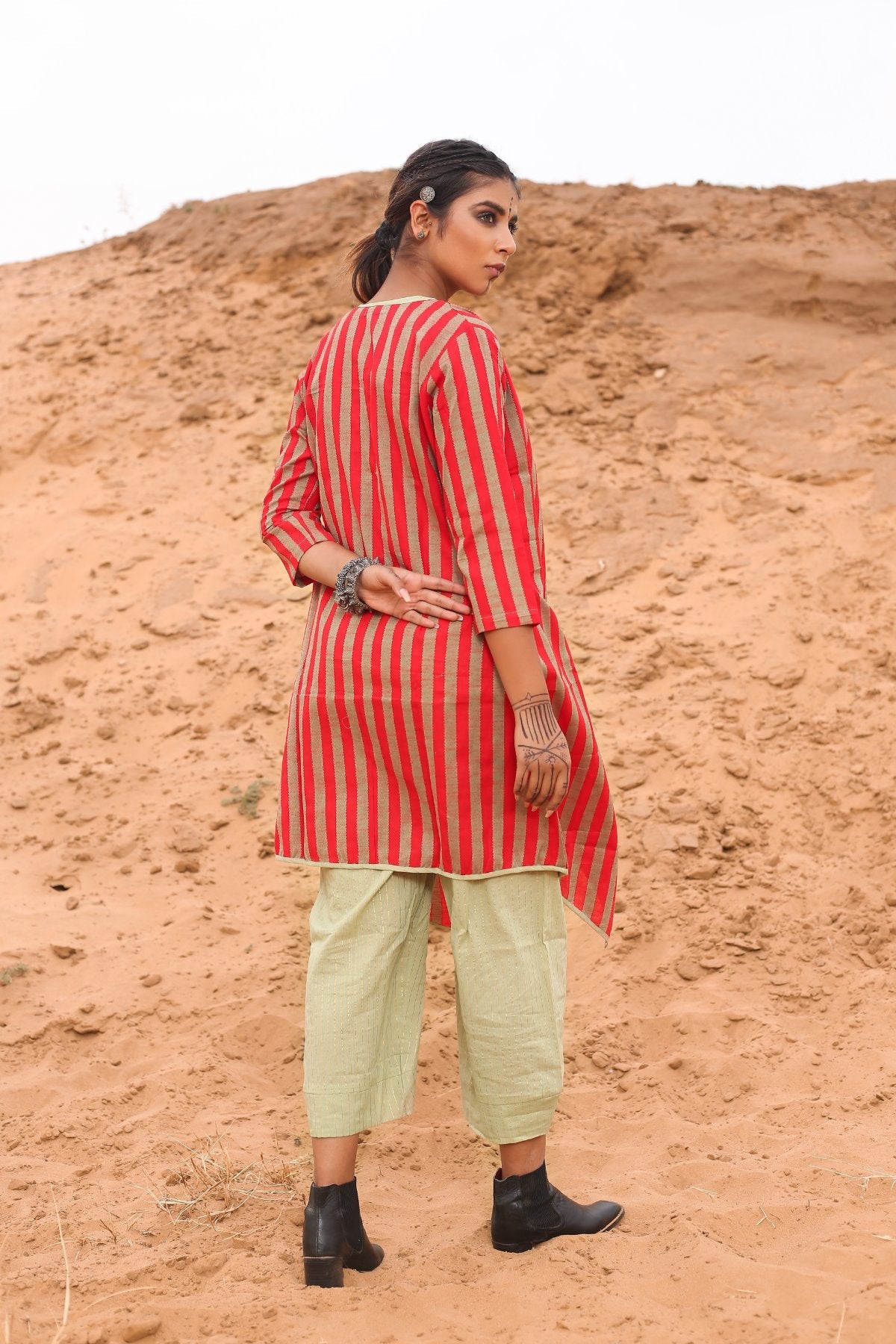 Top With Pants And Red Striped Cape - Set Of Three at Kamakhyaa by Keva. This item is Cape, Co-ord Sets, Cotton, Cotton Lurex, Desert Rose, Natural, Office Wear Co-ords, Red, Relaxed Fit, Resort Wear, Stripes, Travel, Travel Co-ords, Womenswear