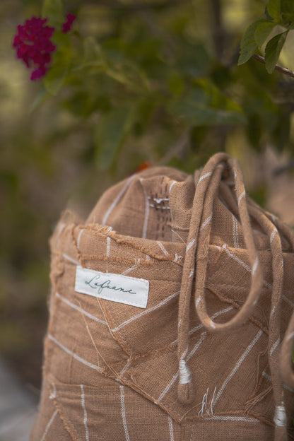 Upcycled Drawstring Bag at Kamakhyaa by Lafaani. This item is 100% pure cotton, Bags, Brown, Casual Wear, Materiality, Organic, Regular Fit, Solids, Undyed and Unbleached, Upcycled