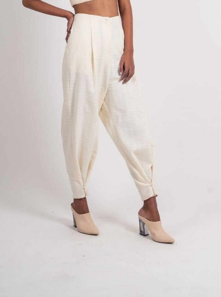 White Ankle Loop Pant at Kamakhyaa by Ahmev. This item is Casual Wear, Fitted At Waist, Handloom Cotton, July Sale, July Sale 2023, Natural, Pants, Textured, White, Womenswear