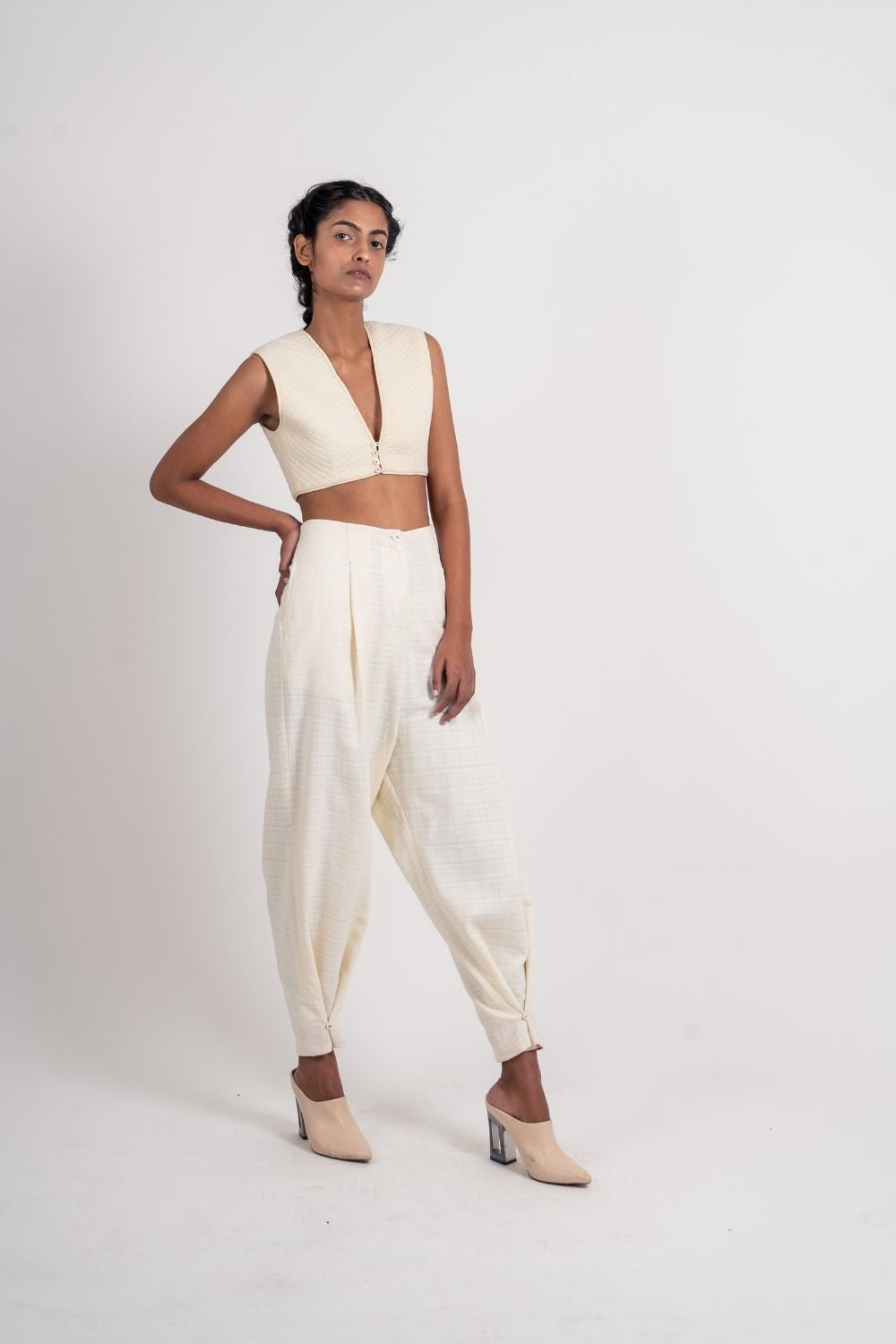 White Ankle Loop Pant at Kamakhyaa by Ahmev. This item is Casual Wear, Fitted At Waist, Handloom Cotton, July Sale, July Sale 2023, Natural, Pants, Textured, White, Womenswear