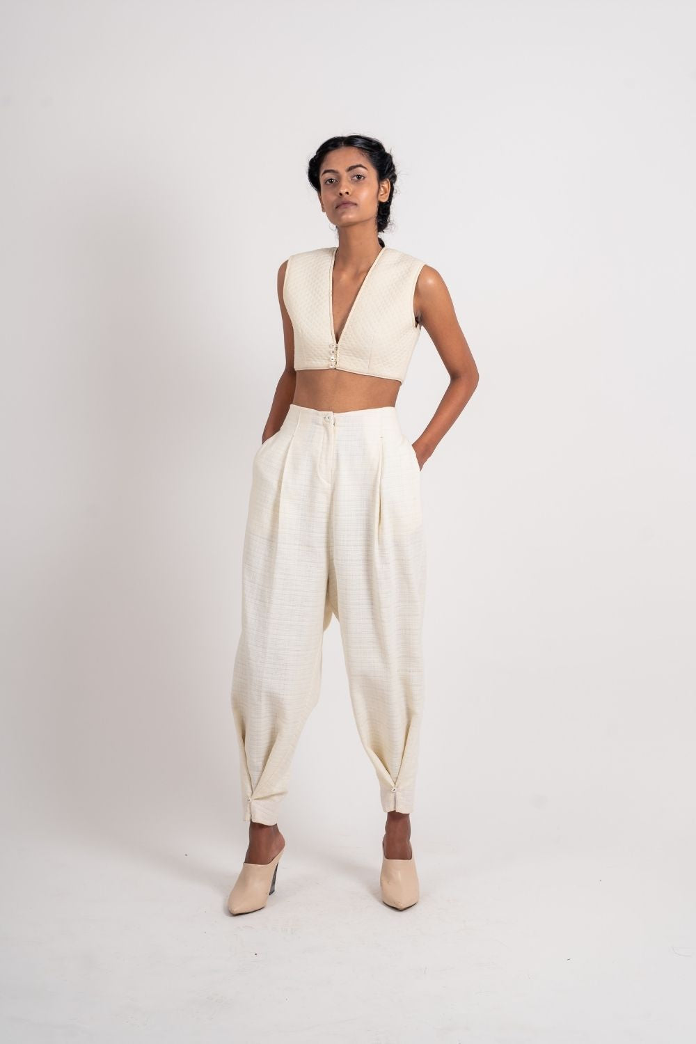White Ankle Loop Pant at Kamakhyaa by Ahmev. This item is Casual Wear, Fitted At Waist, Handloom Cotton, July Sale, July Sale 2023, Natural, Pants, Textured, White, Womenswear