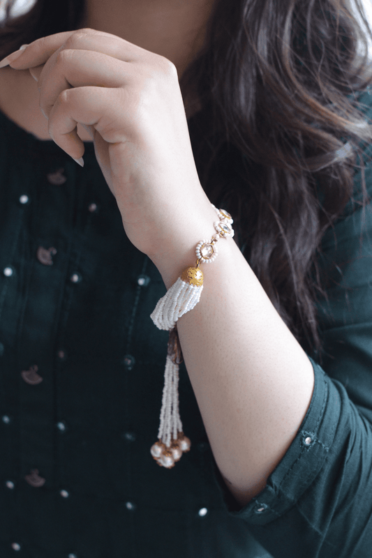White Bracelet Varuni Tassel at Kamakhyaa by House Of Heer. This item is Add Ons, Alloy Metal, Bracelets, Festive Jewellery, Festive Wear, Free Size, jewelry, July Sale, July Sale 2023, Less than $50, Natural, Pearl, Polkis, Textured, White