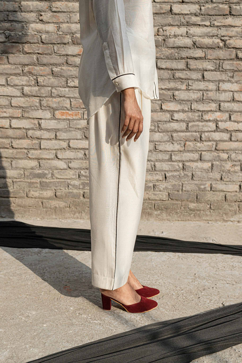 White Classic Pants at Kamakhyaa by Ahmev. This item is Casual Wear, Chanderi, Ink And Ivory, Natural, Pants, Prints, Relaxed Fit, White, Womenswear
