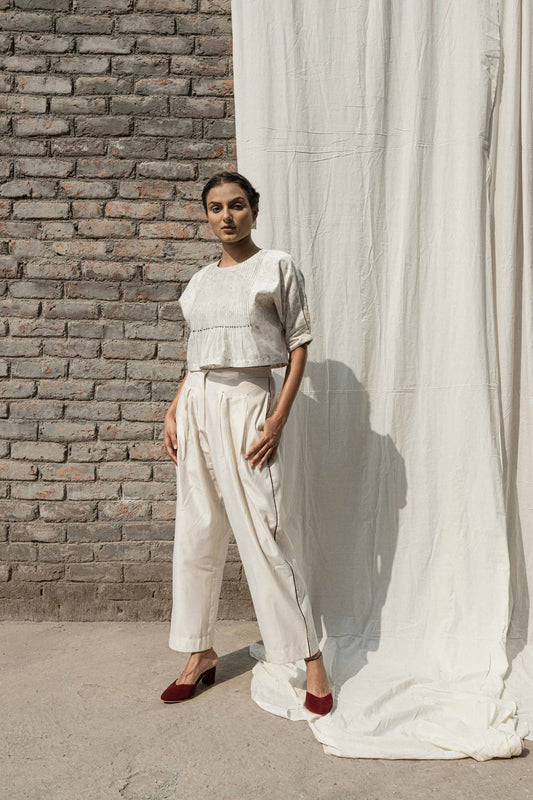 White Classic Pants at Kamakhyaa by Ahmev. This item is Casual Wear, Chanderi, Ink And Ivory, Natural, Pants, Prints, Relaxed Fit, White, Womenswear