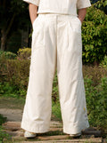 White Cotton Boyfriend Pants at Kamakhyaa by Ahmev. This item is Batik, Casual Wear, Cotton, Fitted At Waist, Handpainted, July Sale, July Sale 2023, Natural, Palazzo Pants, Solids, White, Womenswear
