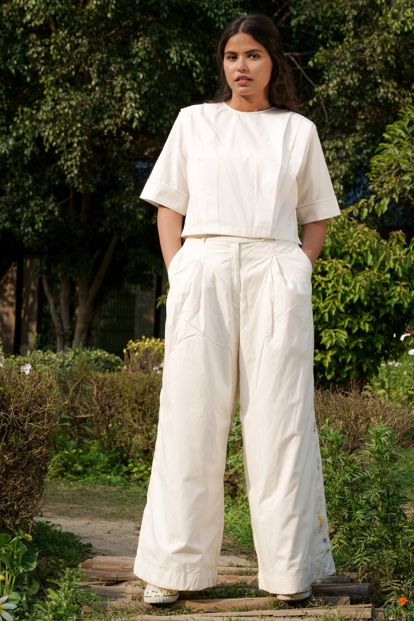 White Cotton Boyfriend Pants at Kamakhyaa by Ahmev. This item is Batik, Casual Wear, Cotton, Fitted At Waist, Handpainted, July Sale, July Sale 2023, Natural, Palazzo Pants, Solids, White, Womenswear