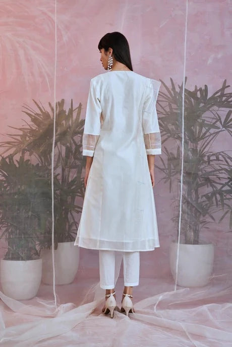 White Cotton Chanderi Kurta Set With Organza Dupatta at Kamakhyaa by Charkhee. This item is Aasmaa, Chanderi, Cotton, Embellished, Indian Wear, Kurta Pant Sets, Kurta Set With Dupatta, Natural, Organza, Relaxed Fit, Sequin work, Wedding Wear, White, Womenswear
