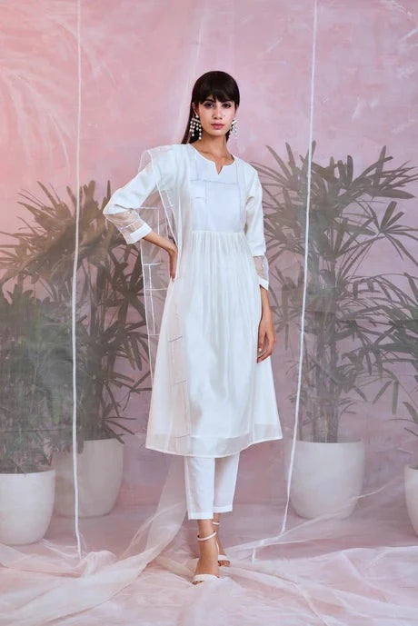 White Cotton Chanderi Kurta Set With Organza Dupatta at Kamakhyaa by Charkhee. This item is Aasmaa, Chanderi, Cotton, Embellished, Indian Wear, Kurta Pant Sets, Kurta Set With Dupatta, Natural, Organza, Relaxed Fit, Sequin work, Wedding Wear, White, Womenswear