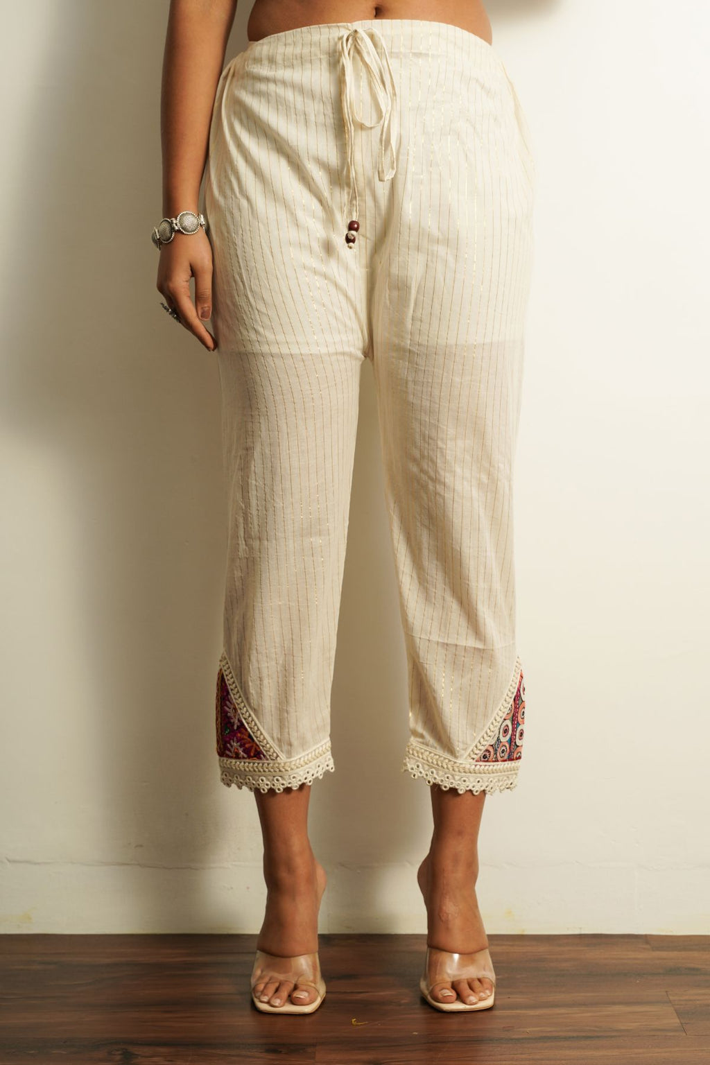White Cotton Embroidered Pant at Kamakhyaa by Keva. This item is 100% cotton, Best Selling, Capris, Fusion Wear, Less than $50, Natural, New, Off-white, Regular Fit, Saba, Solids, White, Womenswear
