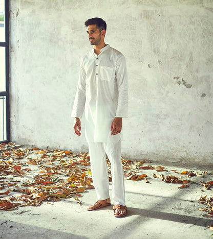 White Cotton Kurta Pyjama set at Kamakhyaa by Khara Kapas. This item is Casual Wear, Cotton, Kurta Pant Sets, Mens Co-ords, Menswear, Natural, New, Regular Fit, Solids, White