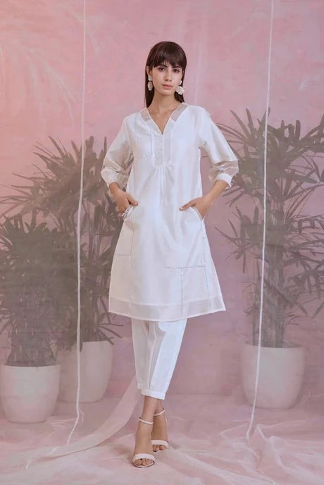 White Cotton Kurta Set With Organza Dupatta at Kamakhyaa by Charkhee. This item is Aasmaa, Chanderi, Cotton, Embellished, Indian Wear, Kurta Pant Sets, Kurta Set With Dupatta, Natural, Organza, Relaxed Fit, Sequin work, Wedding Wear, White, Womenswear