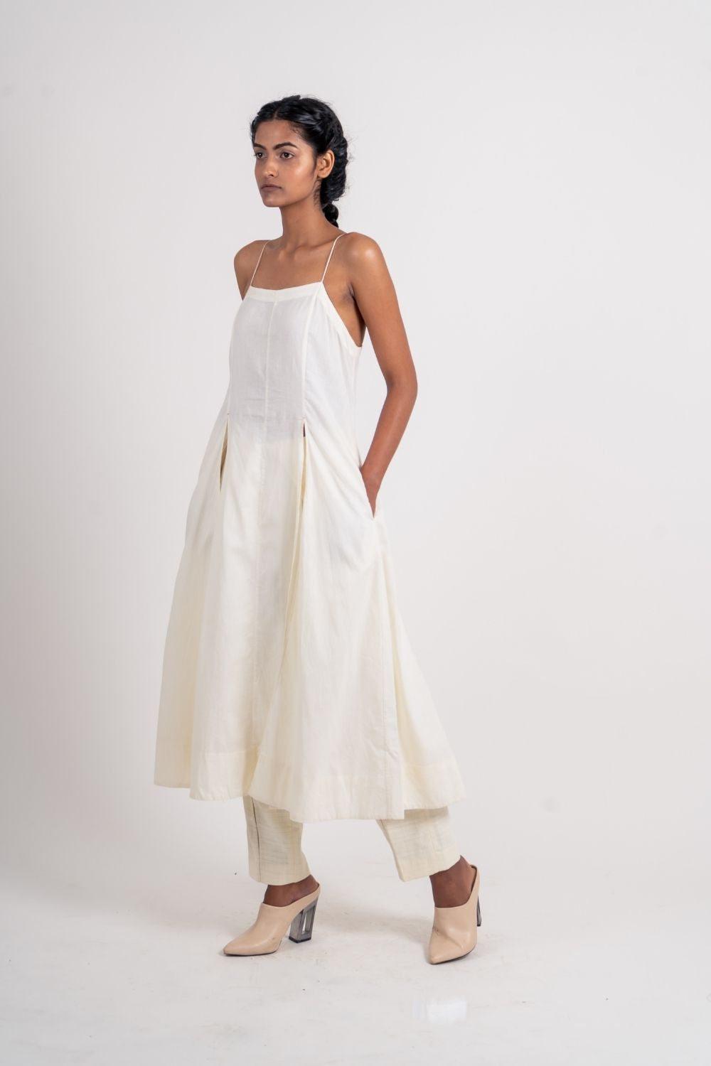 White Cotton Long Dress at Kamakhyaa by Ahmev. This item is Casual Wear, Handloom Cotton, July Sale, July Sale 2023, Midi Dresses, Natural, Relaxed Fit, Sleeveless Dresses, Solids, Strap Dresses, White, Womenswear
