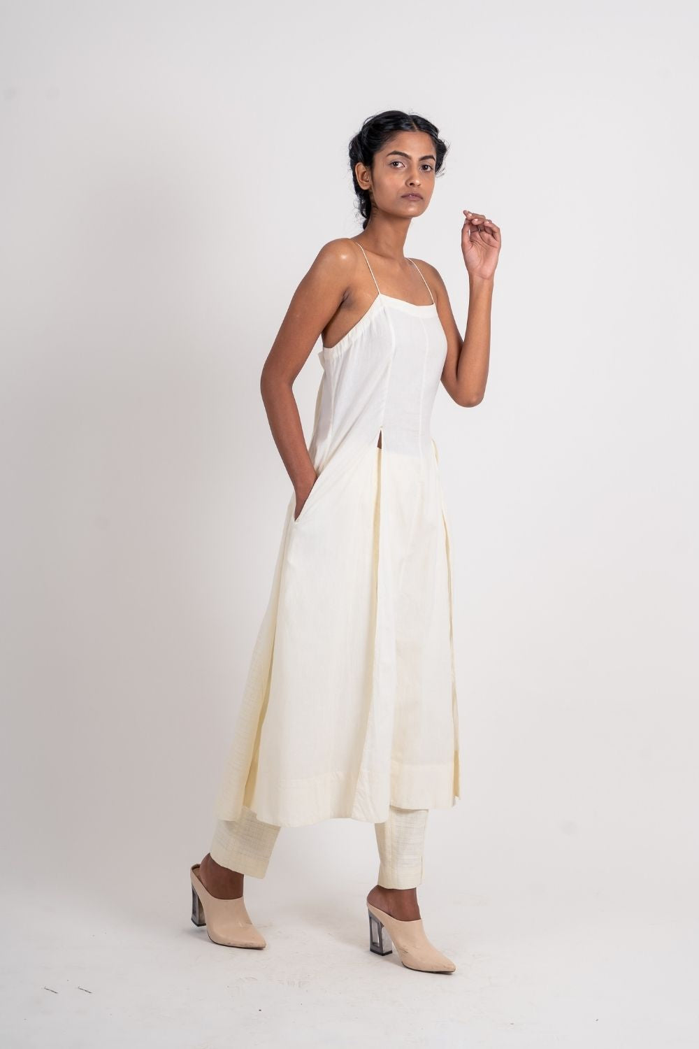 White Cotton Long Dress at Kamakhyaa by Ahmev. This item is Casual Wear, Handloom Cotton, July Sale, July Sale 2023, Midi Dresses, Natural, Relaxed Fit, Sleeveless Dresses, Solids, Strap Dresses, White, Womenswear