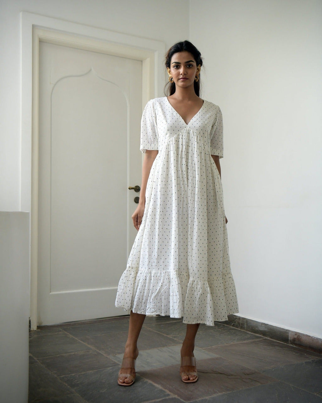 White Cotton Midi Dress at Kamakhyaa by Taro. This item is Best Selling, Evening Wear, FB ADS JUNE, Handwoven cotton, Indo-Western, July Sale, July Sale 2023, Kurtas, Midi Dresses, Natural, Prints, Regular Fit, Tiered Dresses, White, Wildflower Taro, Womenswear