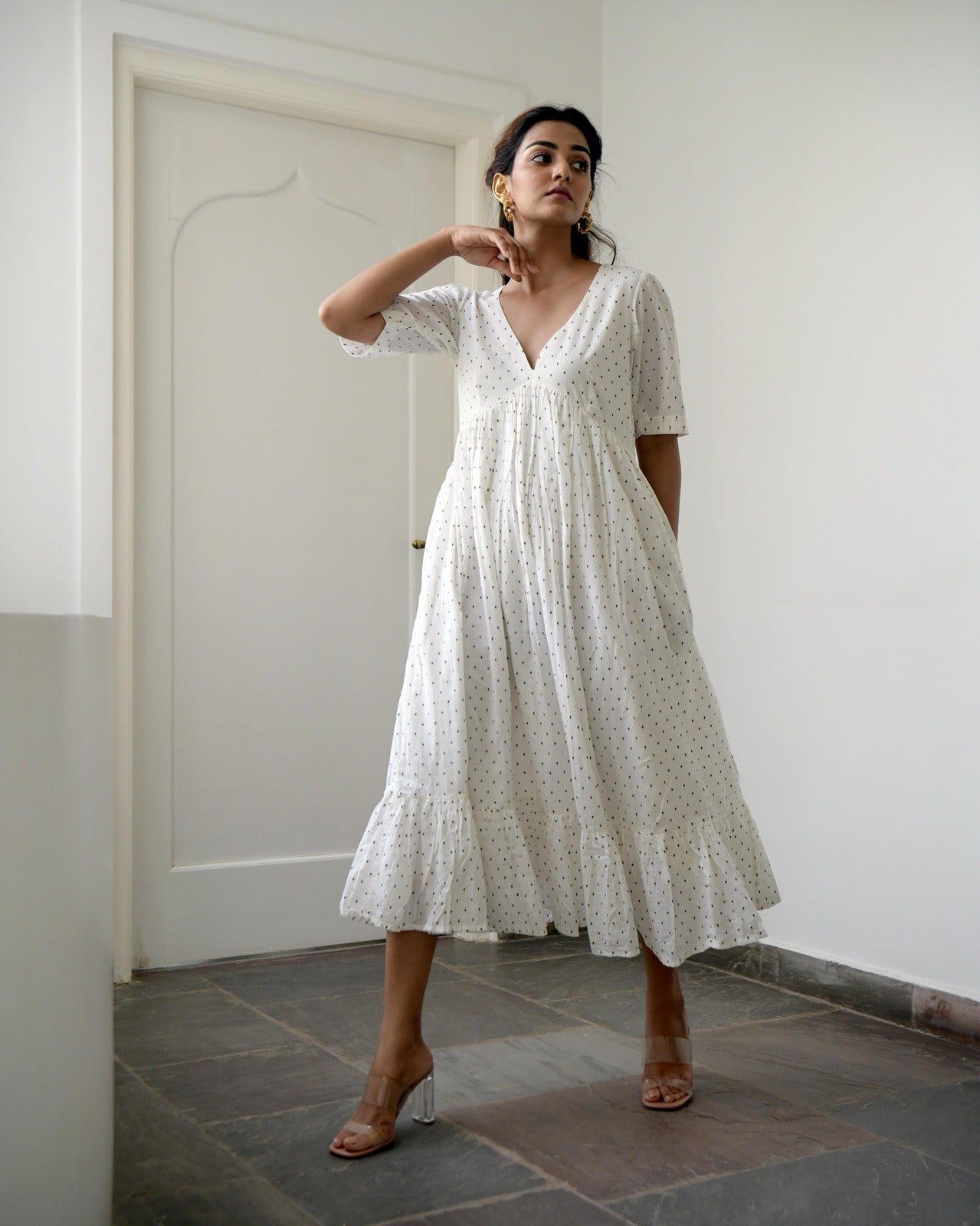 White Cotton Midi Dress at Kamakhyaa by Taro. This item is Best Selling, Evening Wear, FB ADS JUNE, Handwoven cotton, Indo-Western, July Sale, July Sale 2023, Kurtas, Midi Dresses, Natural, Prints, Regular Fit, Tiered Dresses, White, Wildflower Taro, Womenswear