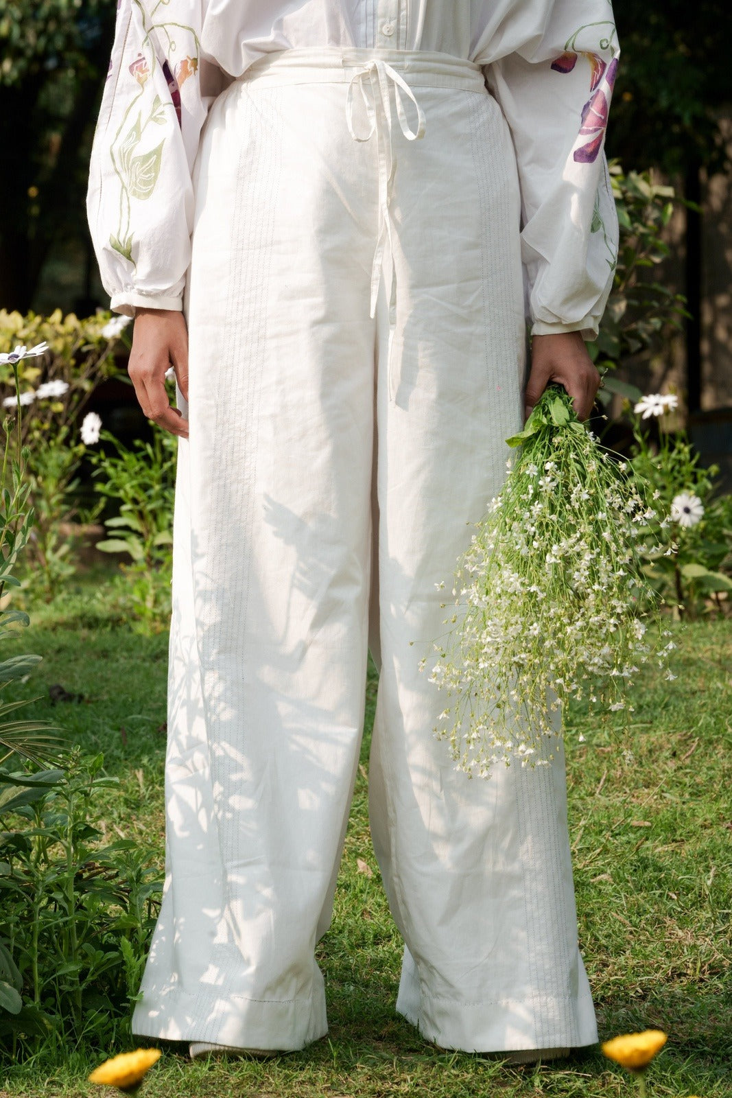 White Cotton Pants at Kamakhyaa by Rias Jaipur. This item is 100% Cotton, Casual wear, Natural, RE 2.O, Regular, Rias JaipurBottoms, solids, Unisex, White, Womenswear