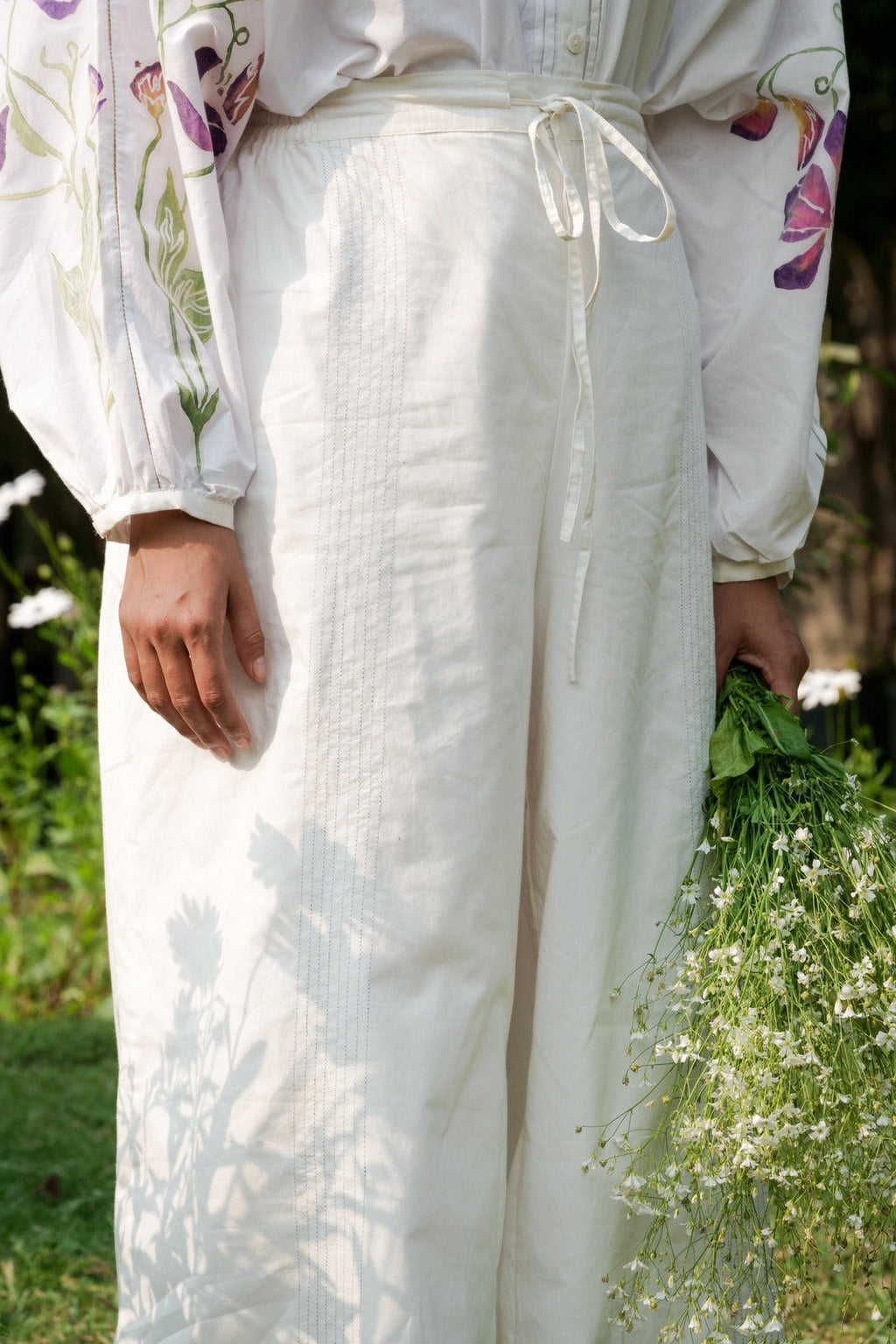 White Cotton Pants at Kamakhyaa by Rias Jaipur. This item is 100% Cotton, Casual wear, Natural, RE 2.O, Regular, Rias JaipurBottoms, solids, Unisex, White, Womenswear