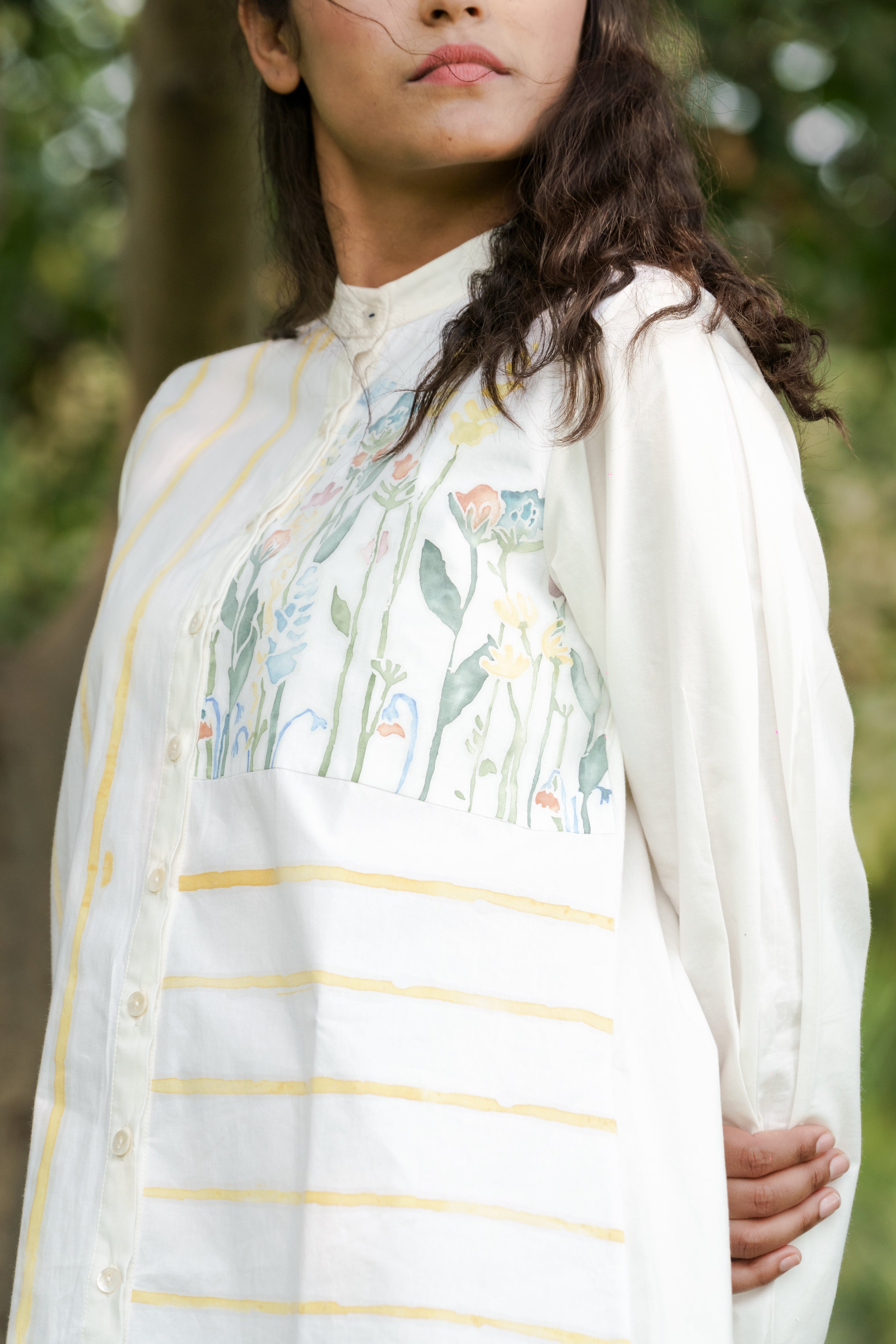 White Cotton Shirt at Kamakhyaa by Ahmev. This item is Batik, Casual Wear, Cotton, FB ADS JUNE, Handpainted, July Sale, July Sale 2023, Natural, Relaxed Fit, Shirt Dresses, Shirts, Stripes, White, Womenswear