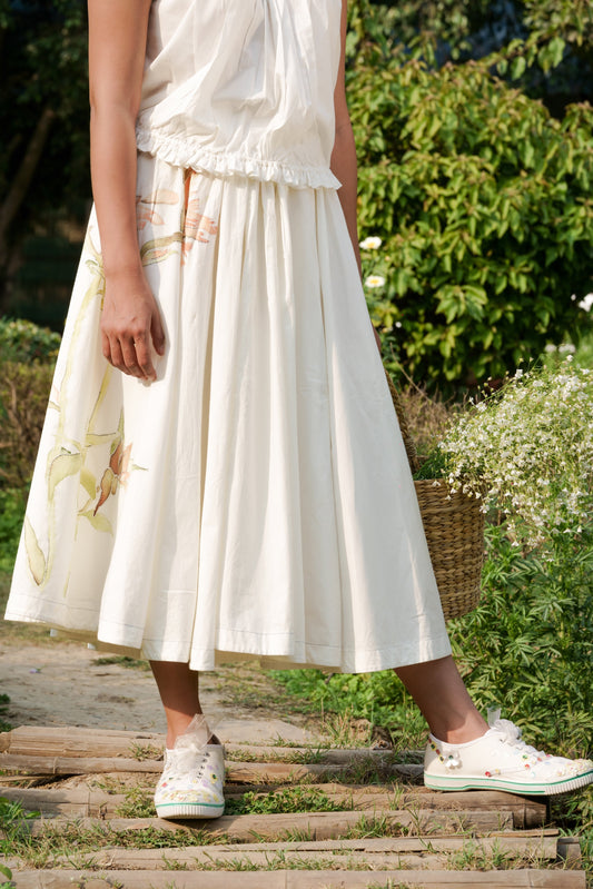 White Cotton circular skirt at Kamakhyaa by Ahmev. This item is Batik, Casual Wear, Cotton, Fitted At Waist, Hanpainted, July Sale, July Sale 2023, Midi Skirts, Natural, Prints, Skirts, White, Womenswear