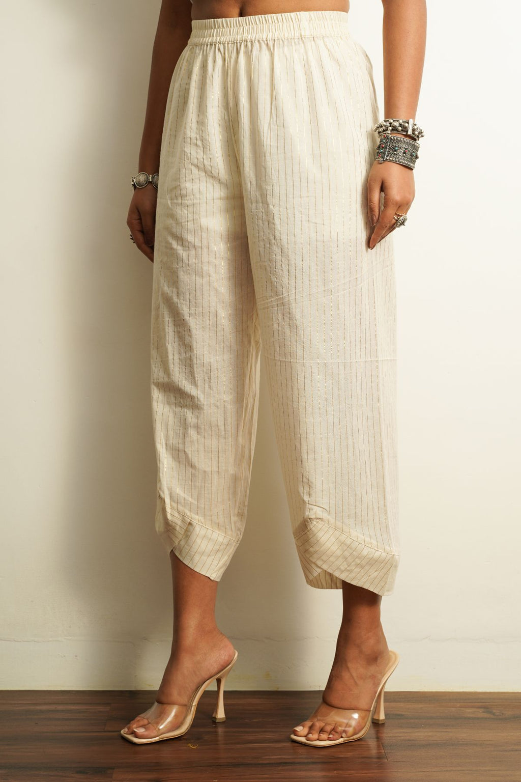 White Embroidered Cotton Pant at Kamakhyaa by Keva. This item is 100% cotton, Best Selling, Capris, Fusion Wear, Less than $50, Natural, New, Off-white, Products less than $25, Relaxed Fit, Saba, Solids, White, Womenswear