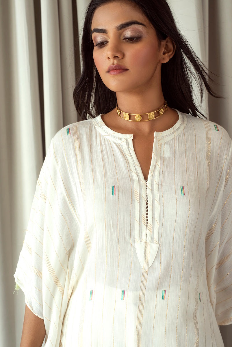 White Embroidered Kaftan at Kamakhyaa by Taro. This item is Bahaar Taro, Cotton Blend, Evening Wear, Indian Wear, July Sale, July Sale 2023, Kaftans, Natural, Regular Fit, Textured, Tops, White, Womenswear