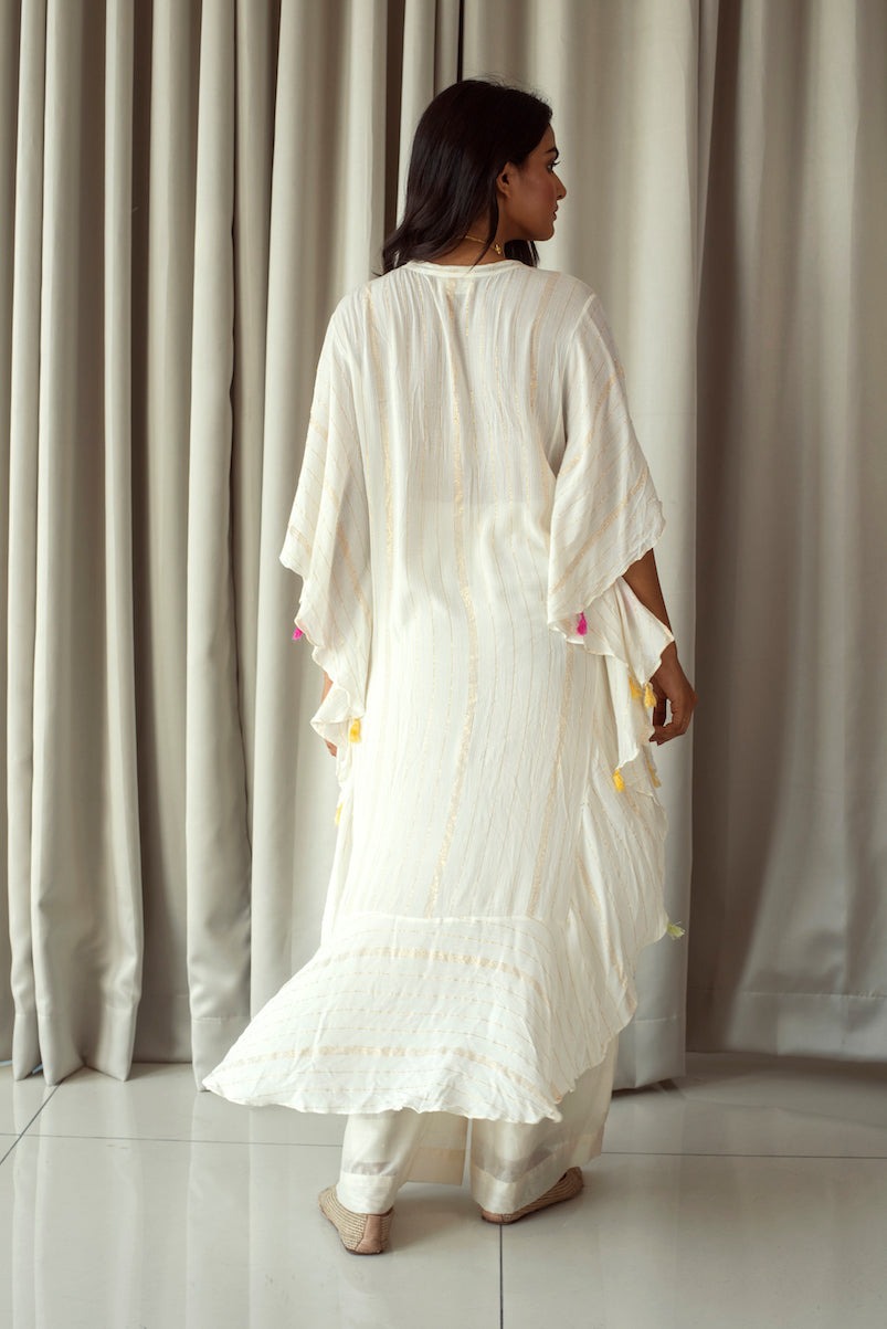 White Embroidered Kaftan at Kamakhyaa by Taro. This item is Bahaar Taro, Cotton Blend, Evening Wear, Indian Wear, July Sale, July Sale 2023, Kaftans, Natural, Regular Fit, Textured, Tops, White, Womenswear