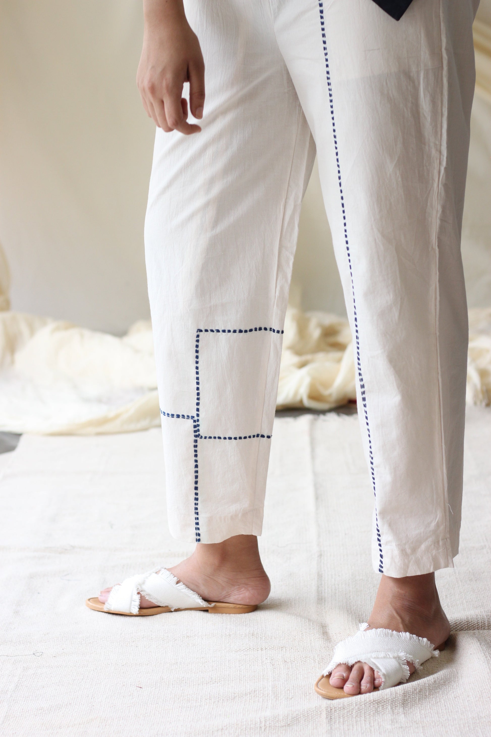 White Embroidered Pants at Kamakhyaa by Chambray & Co.. This item is Casual Wear, Cotton, Embroidered, Natural, Pants, Regular Fit, Solids, White, Womenswear