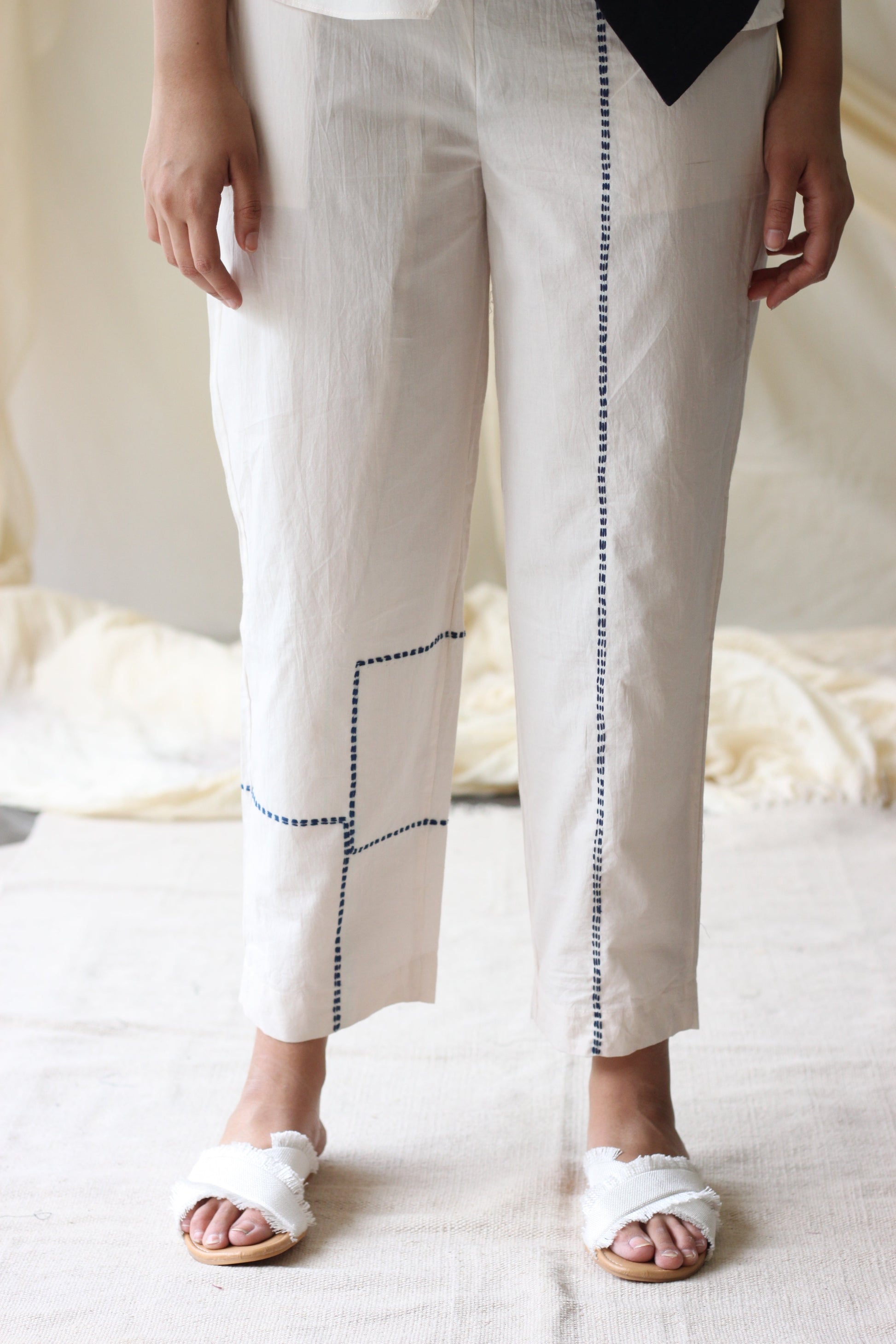 White Embroidered Pants at Kamakhyaa by Chambray & Co.. This item is Casual Wear, Cotton, Embroidered, Natural, Pants, Regular Fit, Solids, White, Womenswear