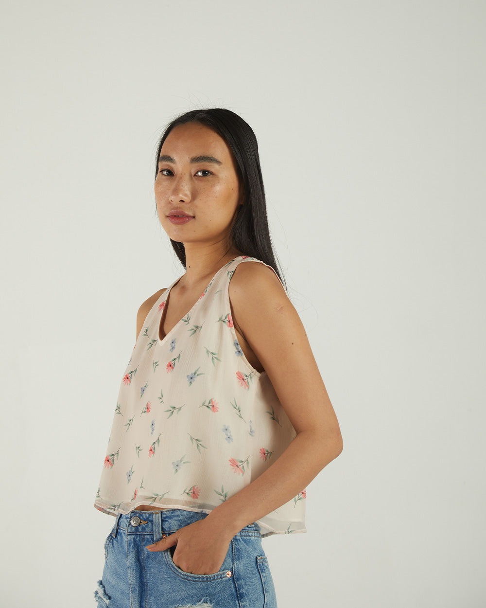 White Floral Sleeveless Crop Top at Kamakhyaa by Reistor. This item is Bemberg, Casual Wear, Chiffon, Crop Tops, Natural, Prints, Tops, White, Womenswear