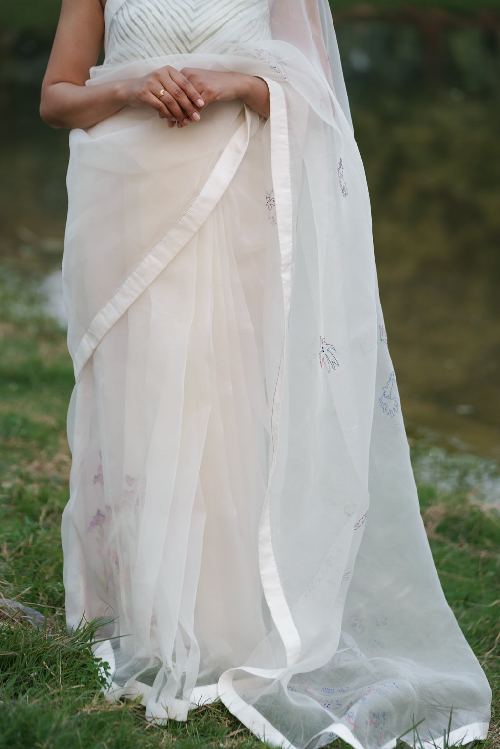 White Hand Embroidered Saree at Kamakhyaa by Ahmev. This item is Casual Wear, Cotton, Indian Wear, July Sale, July Sale 2023, Natural, Relaxed Fit, Sarees, Silk Organza, Stripes, White, Womenswear