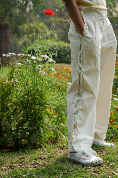 White Hand Painted Pants at Kamakhyaa by Ahmev. This item is Batik, Casual Wear, Cotton, Fitted At Waist, Handpainted, July Sale, July Sale 2023, Natural, Pants, Solids, White, Womenswear