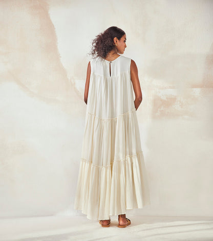 White Lily Bouque at Kamakhyaa by Khara Kapas. This item is Cotton, Endless Summer, Natural, Regular Fit, Resort Wear, Sleeveless Dresses, Solids, Tiered Dresses, White, Womenswear