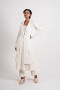 White Long Jacket at Kamakhyaa by Ahmev. This item is Casual Wear, Coats, Handloom Cotton, July Sale, July Sale 2023, Natural, Overlays, Regular Fit, Solids, White, Womenswear