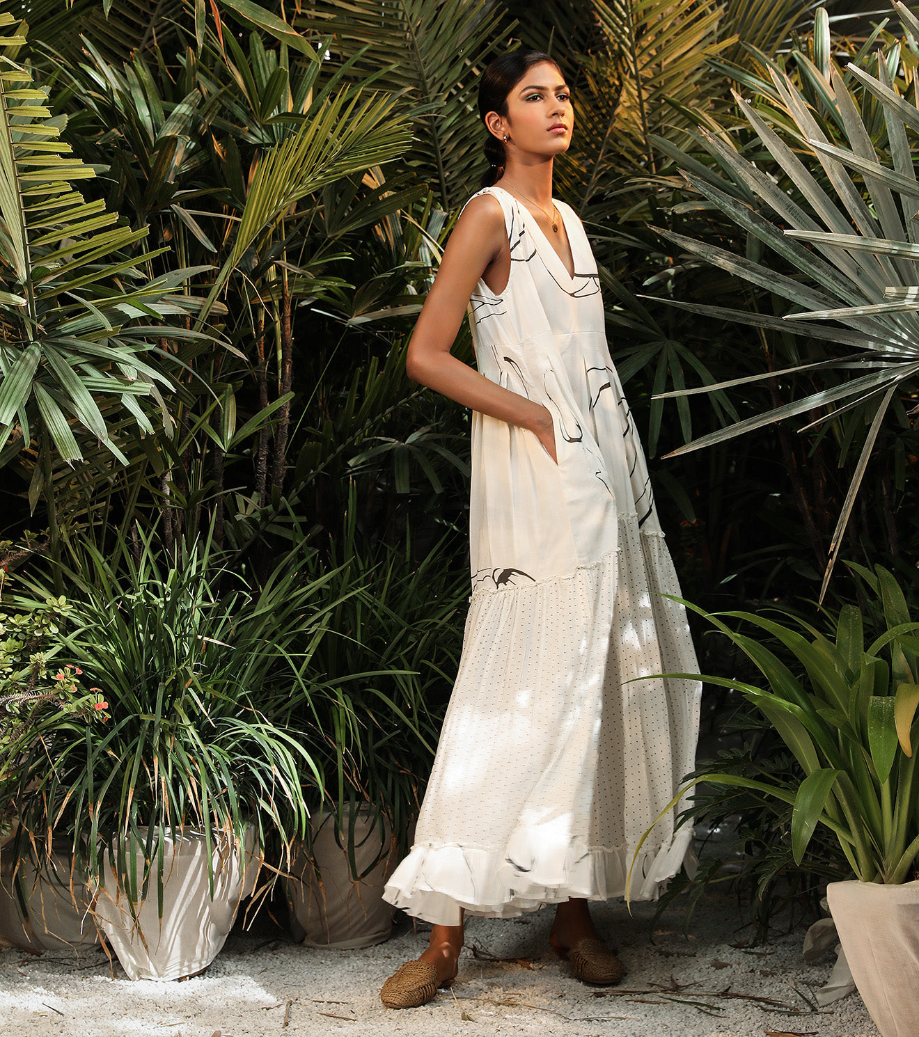 White Maxi Dress-Prints at Kamakhyaa by Khara Kapas. This item is Lost In paradise, Maxi Dresses, Mul Cotton, Natural, Prints, Resort Wear, Sleeveless Dresses, Tiered Dresses, White, Womenswear