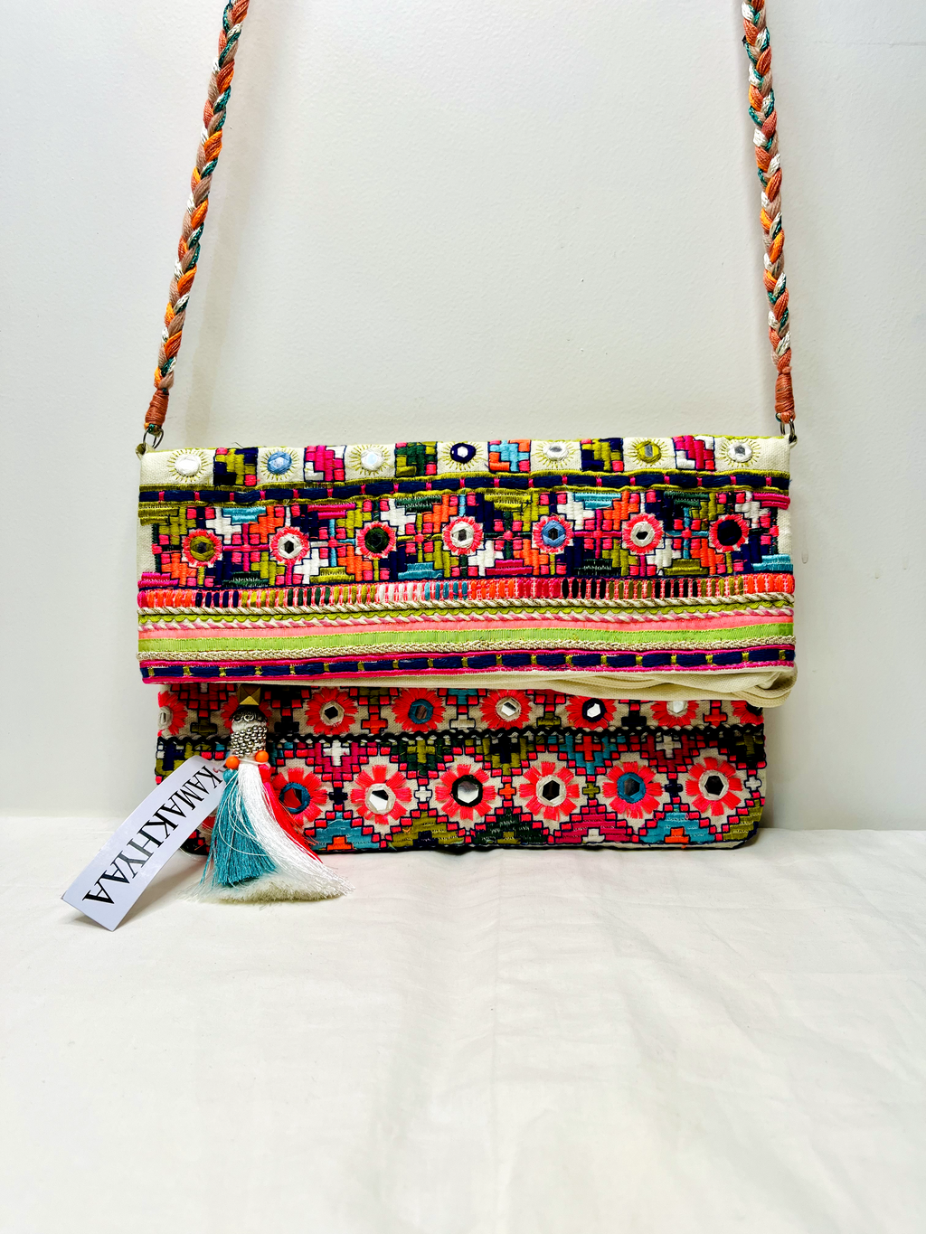 White Multicolor Mirror Tassel Sling Bag at Kamakhyaa by Pre Loved. This item is Bags, Casual Wear, Mirror Work, Multicolor, Natural, Sling Bags