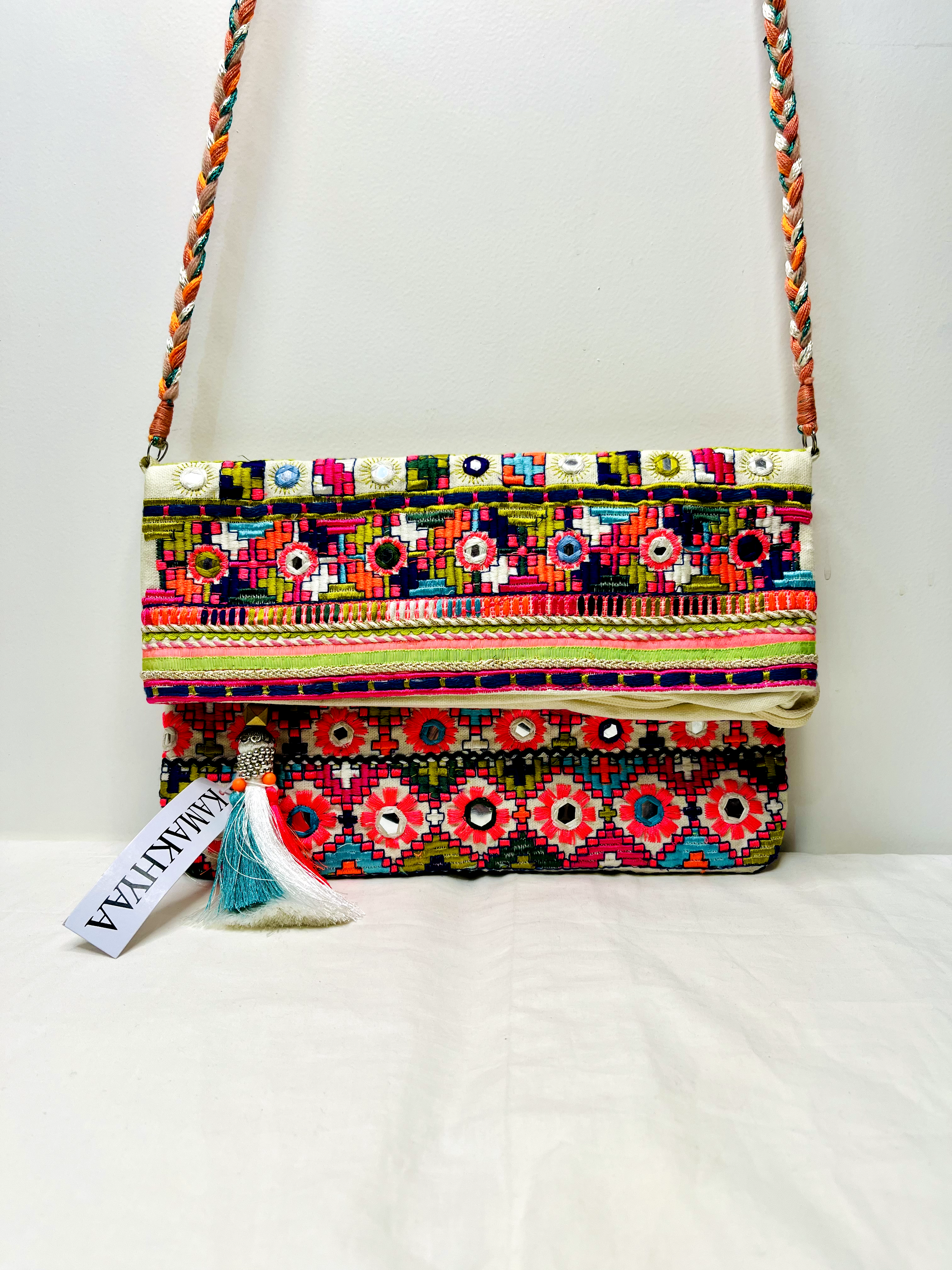 White Multicolor Mirror Tassel Sling Bag at Kamakhyaa by Pre Loved. This item is Bags, Casual Wear, Mirror Work, Multicolor, Natural, Sling Bags