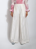 White Pants at Kamakhyaa by The Loom Art. This item is Best Selling, Between the Lines, Chanderi Silk, July Sale, July Sale 2023, Natural, Palazzo Pants, Party Wear, Regular Fit, Solids, White, Womenswear